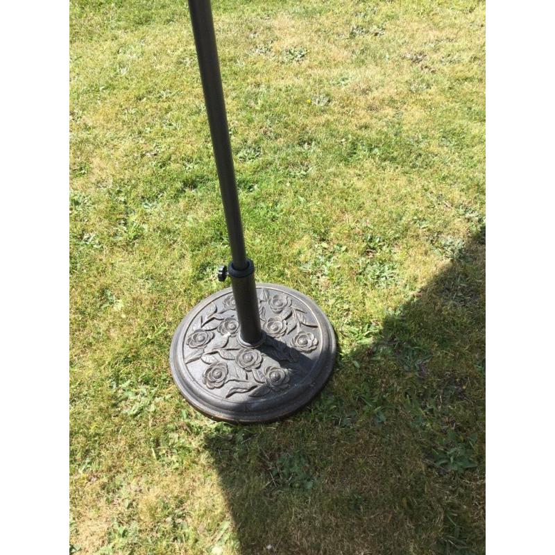New large green parasol and heavy metal base