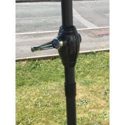 New large green parasol and heavy metal base