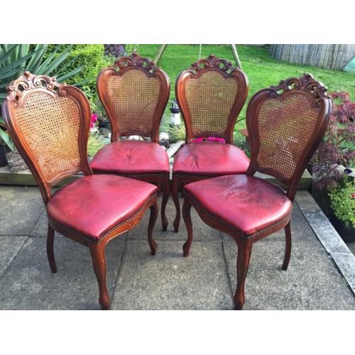 Four wooden dining chairs