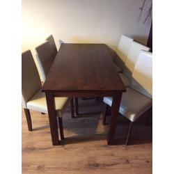 Big dining table with 6 Faux leather chairs