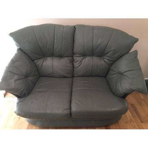 2 X Two leather teal/grey 2 seater sofas. Good condition. 150 Ono
