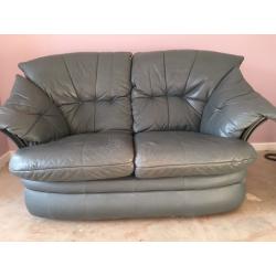 2 X Two leather teal/grey 2 seater sofas. Good condition. 150 Ono