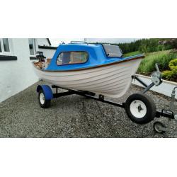 Fishing boat with cuddy outboard trailer