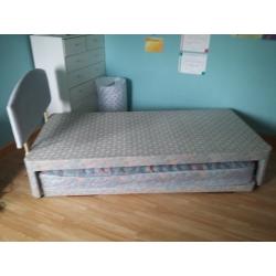 Single bed with headboard and also has trundle pull out bed with trundle mattress