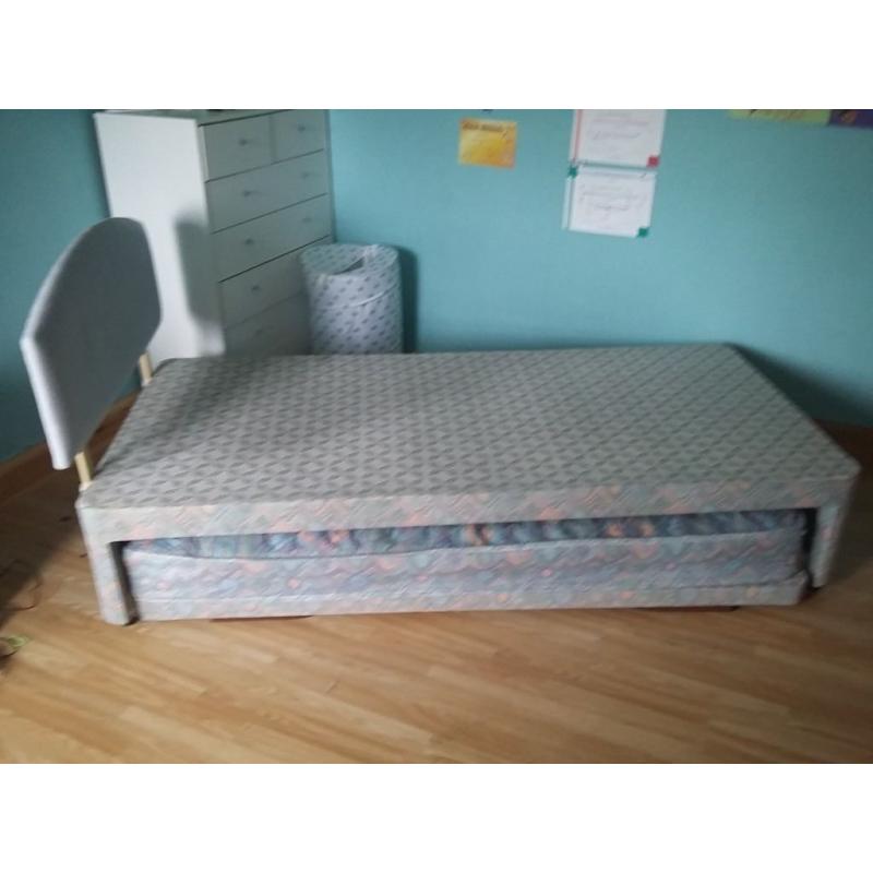 Single bed with headboard and also has trundle pull out bed with trundle mattress
