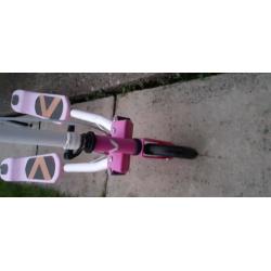 Pink and white scooter