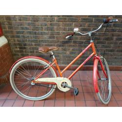 Barracuda Delphinus Hybrid Town Bicycle In Orange. With Front Wicker Basket