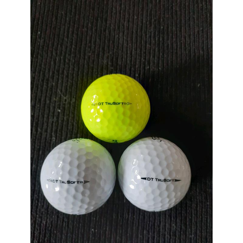 25 Titleist DT Trusoft golf balls.