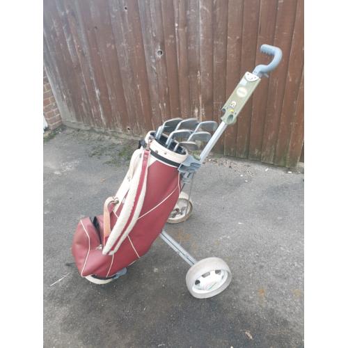 Golf clubs with bag and trolley