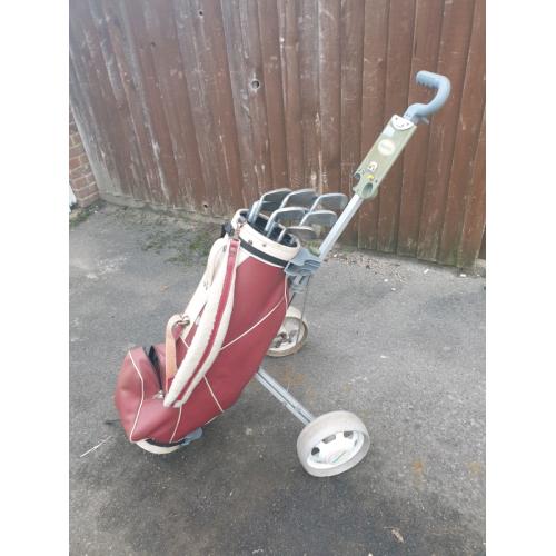Golf clubs with bag and trolley